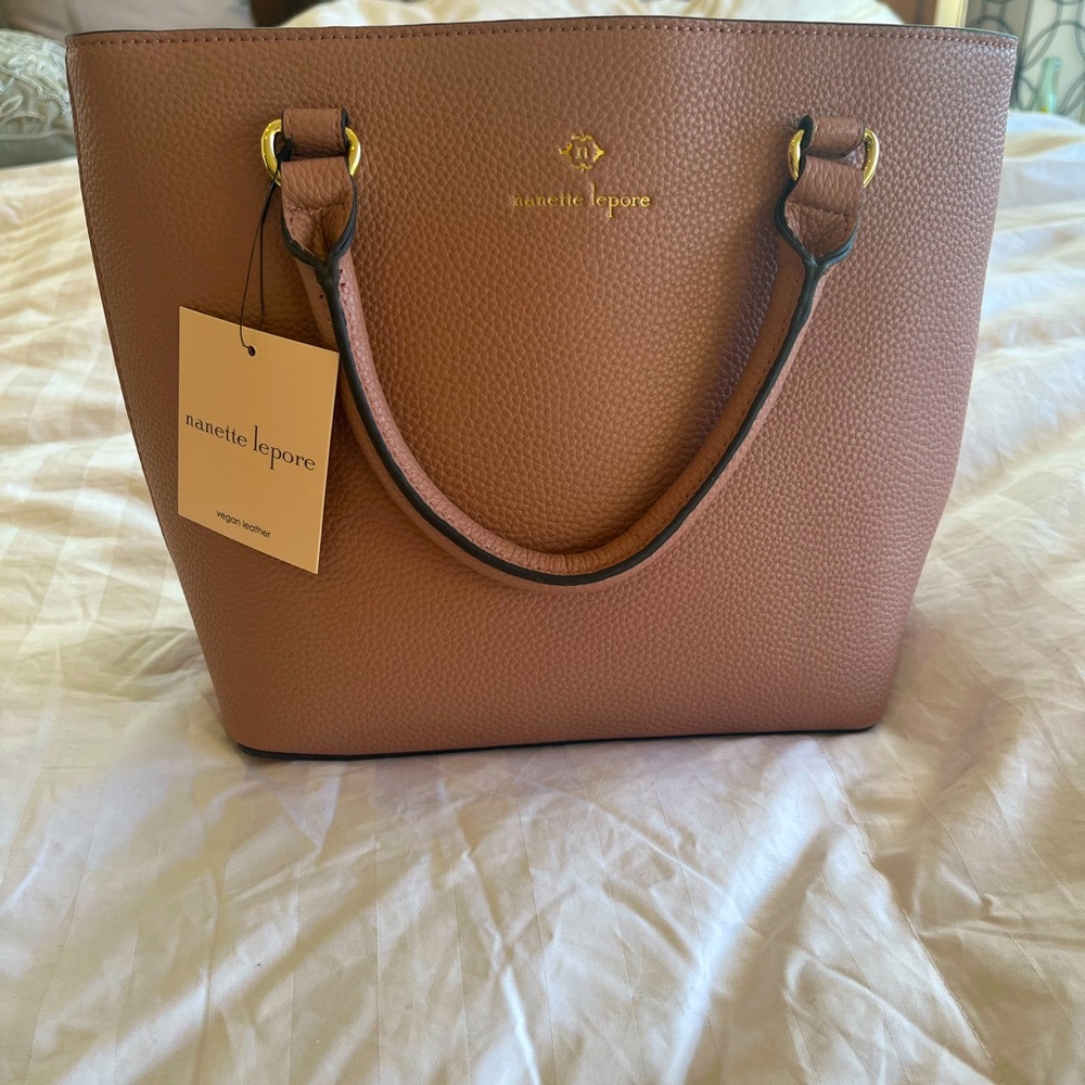 Soft pink, new with tags, approx 11x10 purse.